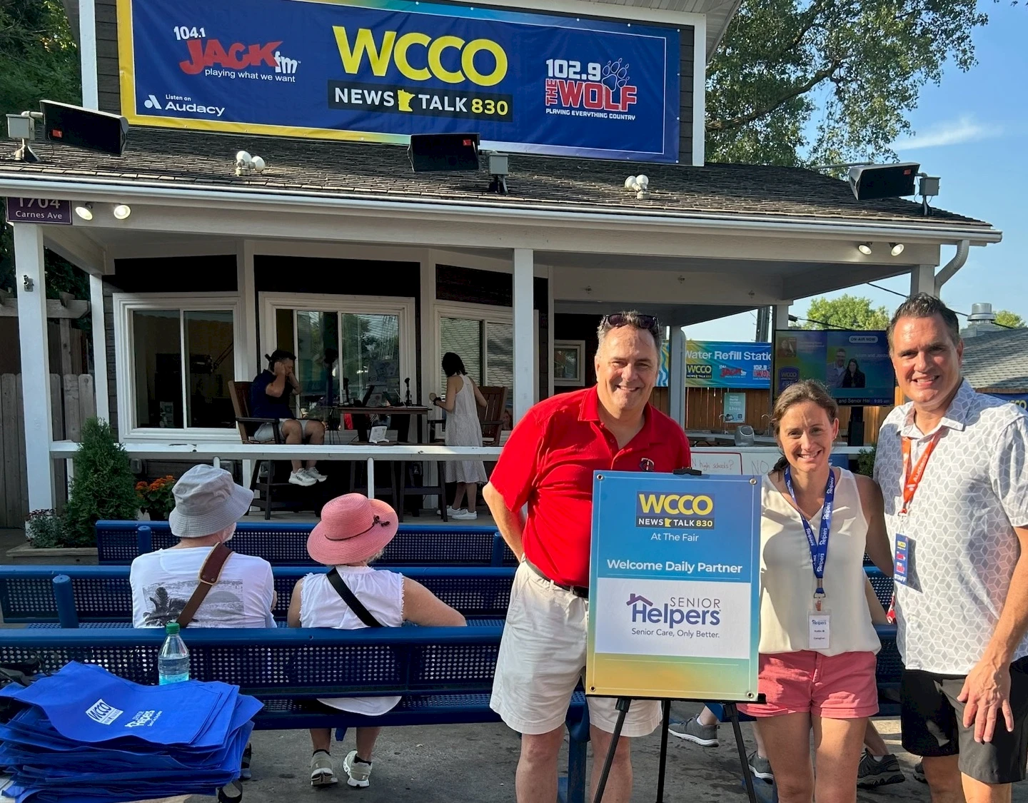 Senior Helpers of Twins Cities co-sponsors Senior Day at Minnesota State Fair. Pictured l-r: Paul Barthol, Senior Helpers North Metro & Edina, Kaitlin McDaniel, Senior Helpers Lake Minnetonka Region and Kevin Lenhart of WCCO.